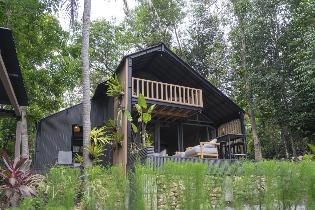 Mila IV+II exterior — real photo of the two-story unit with wood balcony